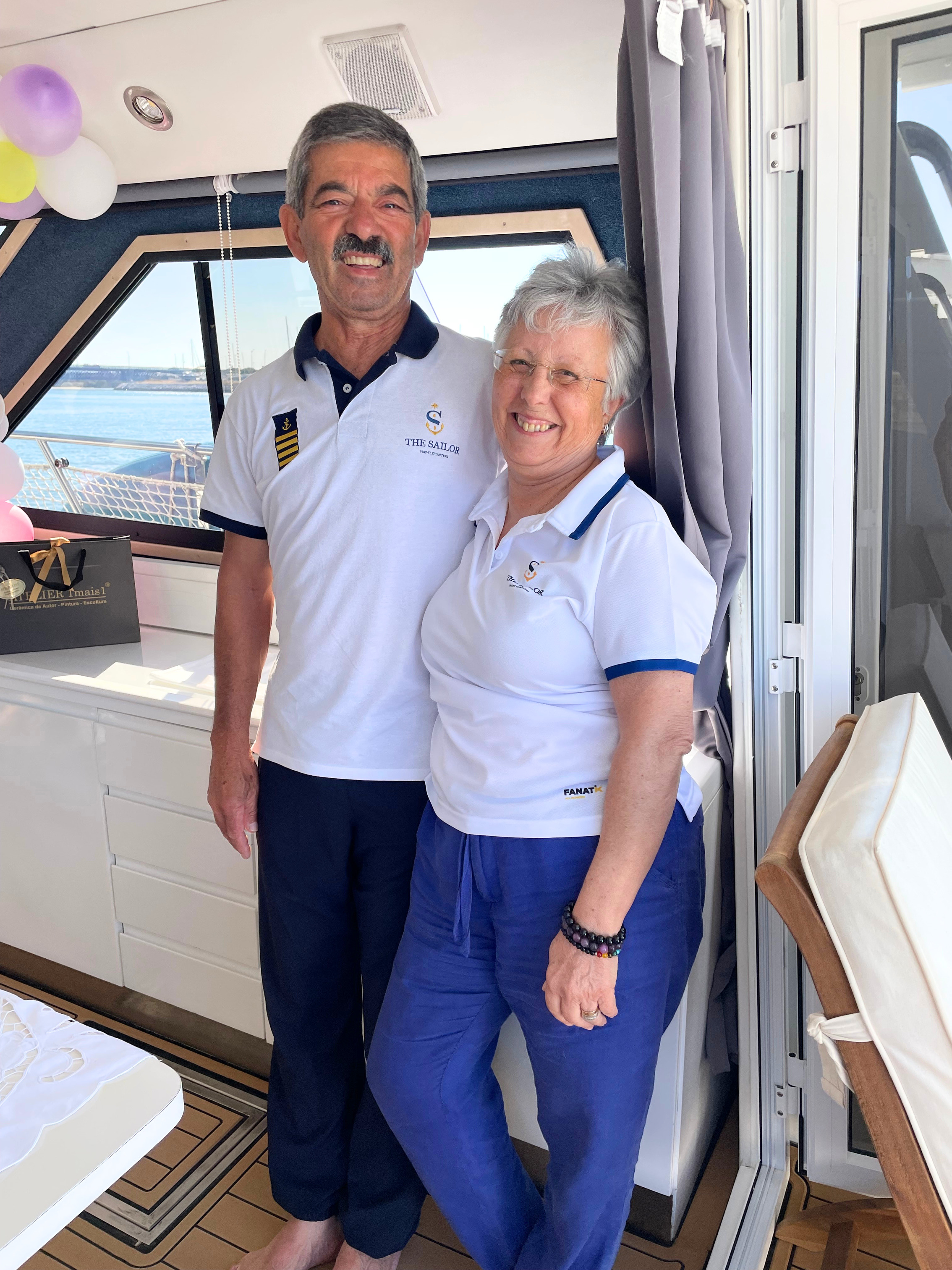 The aft deck of Julieta with the Algarve cliffs behind.